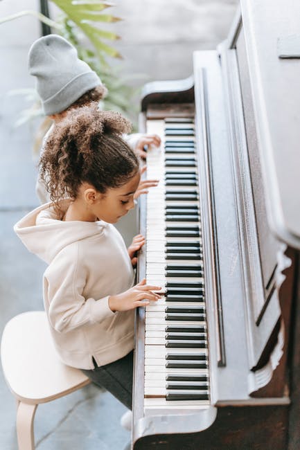 Kids learning piano